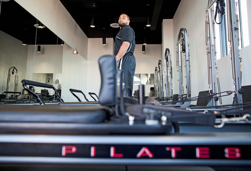 Kedric Golston (pictured at the November 2011 grand opening) and Lorenzo Alexander have expanded The Studio MBS beyond Pilates to include other classes and even after-school care for kids. (Pratik Shah/The Washington Times)