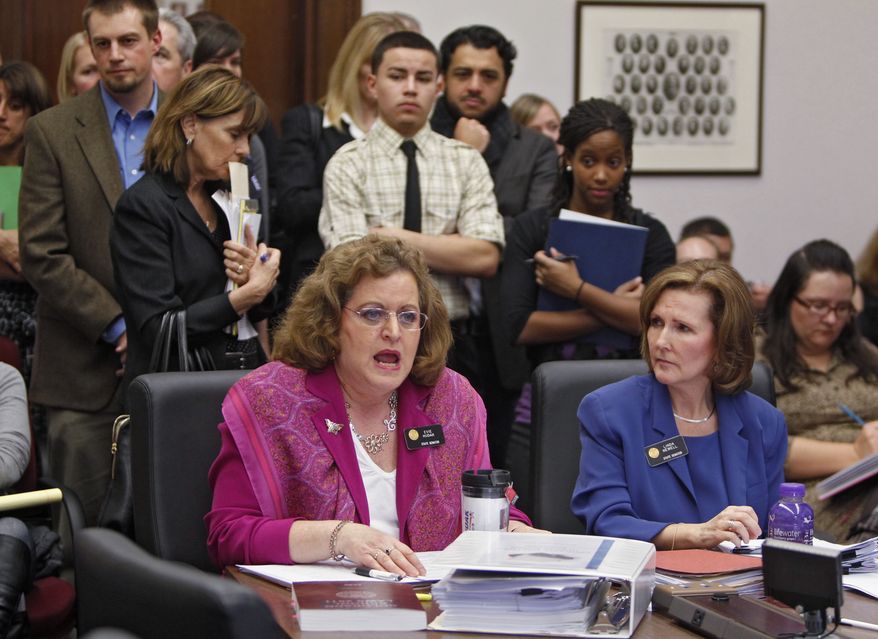 **FILE** Colorado state Sens. Evie Hudak (left), Westminster Democrat, and Linda Newell, Littleton Democrat, testify on their joint bill on school discipline during a hearing at the Capitol in Denver on Feb. 16, 2012. (Associated Press)