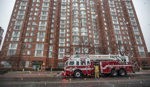 Fairfax County firefighters respond to a call in Alexandria, Va., Wednesday, March 6, 2013. (Andrew S. Geraci/The Washington Times)