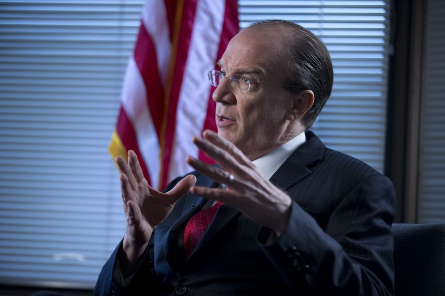 Stuart Bowen, special inspector general for Iraq reconstruction, gestures during an interview in his office in Arlington, Va., on Tuesday, Feb. 19, 2013. (AP Photo/Evan Vucci)