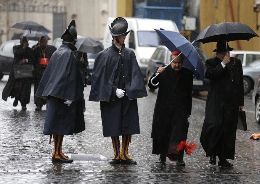 Cardinal Carlo Caffarra, second from right, and Cardinal Raymond Leo Burke, right, walk past two Swiss guards as they leave after a meeting at the Vatican, Friday, March 8, 2013. (AP Photo/Alessandra Tarantino)