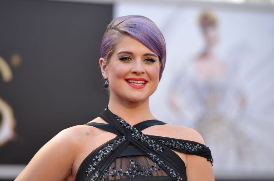 TV personality Kelly Osbourne arrives at the 85th Academy Awards at the Dolby Theatre in Los Angeles on Sunday, Feb. 24, 2013. (John Shearer/Invision/AP)