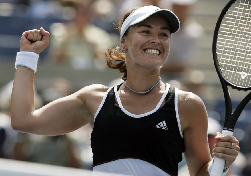 **FILE** In this Aug. 30, 2007 file photo, Swiss tennnis player Martina Hingis celebrates after defeating Pauline Parmentier of France at the US Open tennis tournament in New York. Five-time Grand Slam singles champion Hingis heads the 2013 class for the International Tennis Hall of Fame. The other new members of the Hall announced Monday, March 4, 2013 are Cliff Drysdale, Charlie Pasarell, and Ion Tiriac. Australian player Thelma Coyne Long's election was announced earlier. (AP Photo/Julie Jacobson, File)