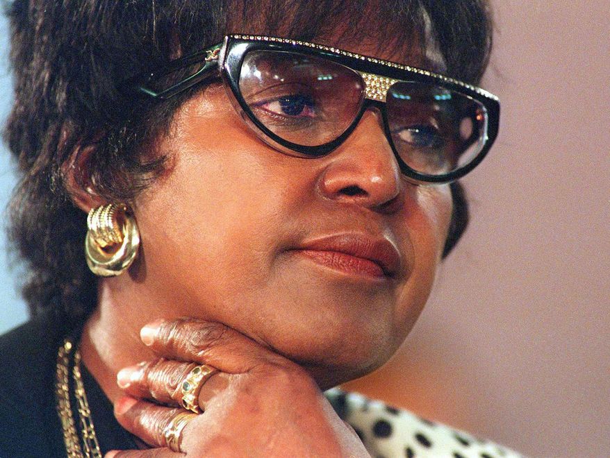 ** FILE ** Winnie Madikizela-Mandela listens to evidence at a Truth and Reconciliation Commission hearing in Johannesburg in 1997. (AP Photo/Odd Anderson, Pool)