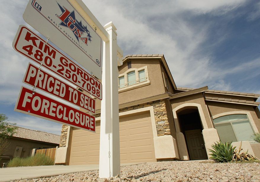 In February, the number of homes going into foreclosure saw a slight increase from January. But the rate was down from the same time last year, according to a monthly report from RealtyTrac. Bank repossessions also declined. (Associated Press)