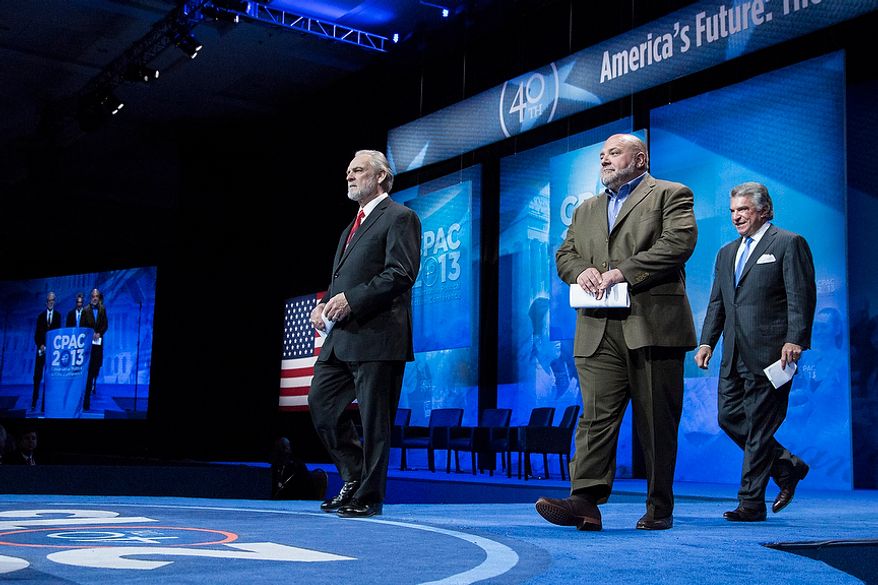 Larry Beasley, from left, president and CEO of The Washington Times, Tony Fabrizio, of the Fabrizio-McLaughlin polling firm, and Al Cardenas, chairman of the American Conservative Union, take the stage to announce the results of the Washington Times/CPAC 2013 straw poll during the final day of the 2013 Conservative Political Action Conference in Fort Washington, Md. on March 16, 2013. Sen. Rand Paul (R-KY) was the winner, narrowly edging out the close second place Sen. Marco Rubio (R-FL). (T.J. Kirkpatrick/Special to The Washington Times)