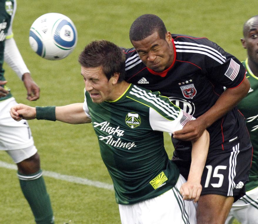 **FILE** Portland Timbers midfielder Ryan Pore, left, and DC United defender Ethan White fight for the ball during the second half of their MLS soccer game in Portland, Ore., Sunday, May, 29, 2011. DC United beat the Timbers 3-2. (AP Photo/Don Ryan)