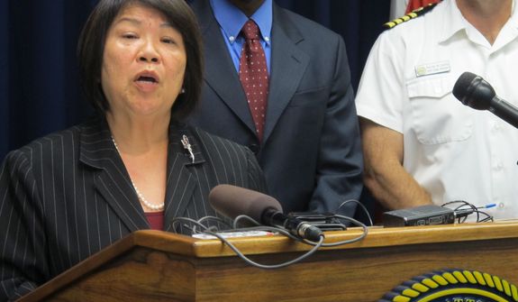 U.S. Attorney Florence Nakakuni announces at a news conference in Honolulu on Monday, March 18, 2013, that authorities have charged Benjamin Pierce Bishop, a U.S. Pacific Command defense contractor, with giving defense secrets to a Chinese woman with whom he was romantically involved. (AP Photo/Audrey McAvoy)