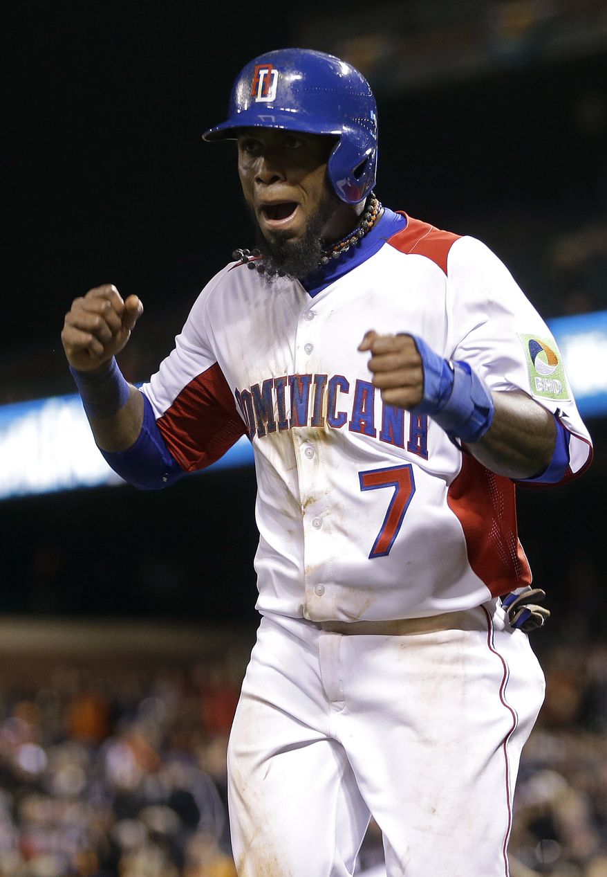 Dominican Republic's Jose Reyes (7) celebrates after scoring against the Netherlands during the fifth inning of a semifinal game of the World Baseball Classic in San Francisco, Monday, March 18, 2013. (AP Photo/Ben Margot)