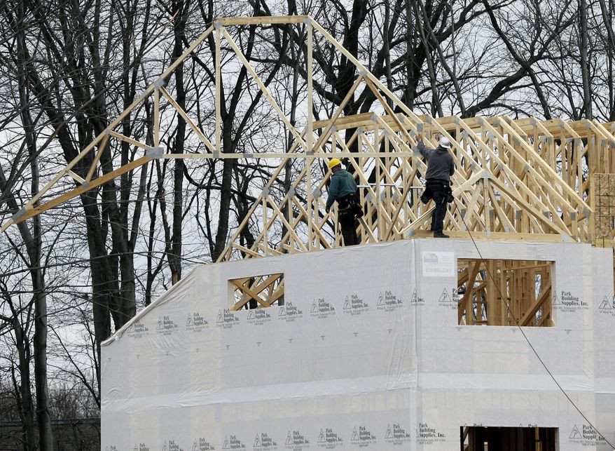 A new town house is under construction at the Crossings adult community in Colonie, N.Y., on Monday, Feb. 25, 2013. (AP Photo/Mike Groll)