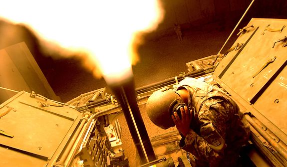 Gunner SPC David Johnson and Assistant Gunner SGT Justin Javar from HHC 1/17th Battalion Mortars 172nd SBCT Ft. Wainwright, AK fire illumination flares over the city of Mosul, Iraq with a 120mm Mortar Cannon June 1, 2006 from a Mortar Carrier Stryker (an eight wheeled medium armored weapons combat troop transport vehicle). The illumination flares being fired will brighten the city in hopes it will help deny the terrorist terrain so they are less likely to place IED's. (U.S. Air Force photo by TSgt Jeremy T. Lock)