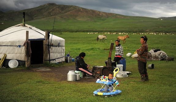 Herders live in a traditional Mongolian dwelling called a Ger. It is suited for the harsh terrain and lifestyle the herders live. The Ger is a round felt tent covered in durable, waterproof, white canvas and is designed to be able to pack up and move. Its round shape keeps the Ger resilient to Mongolia 's ferocious winds, while its felt is rapidly drying material for when it rains or snow melts. (U.S. Air Force photo by Tech. Sgt. Jeremy T. Lock)