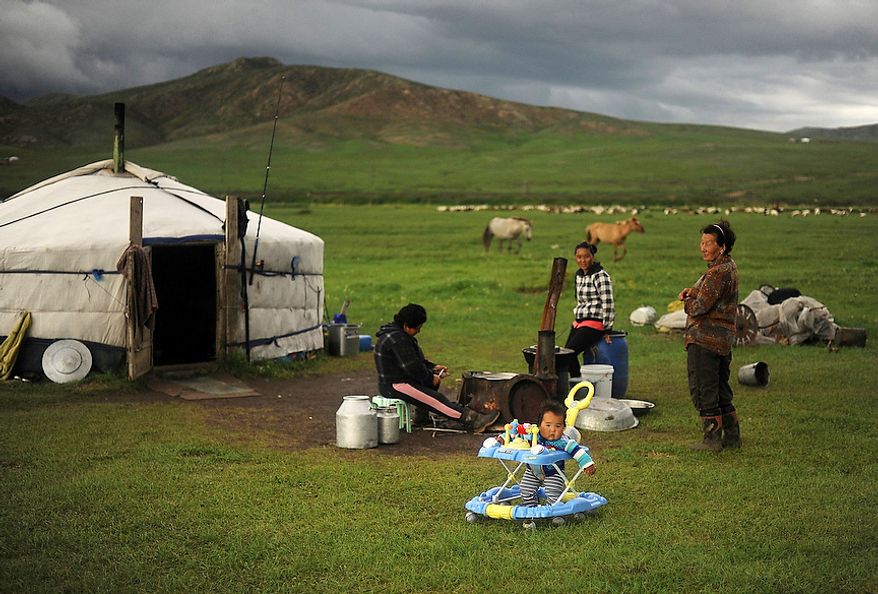 Herders live in a traditional Mongolian dwelling called a Ger. It is suited for the harsh terrain and lifestyle the herders live. The Ger is a round felt tent covered in durable, waterproof, white canvas and is designed to be able to pack up and move. Its round shape keeps the Ger resilient to Mongolia 's ferocious winds, while its felt is rapidly drying material for when it rains or snow melts. (U.S. Air Force photo by Tech. Sgt. Jeremy T. Lock)