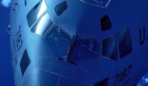Maj. Johnathan Zito pulls in behind a KC-135 Stratotanker to receive fuel off Florida's east coast on July 12, 2012. Zito is a C-17 Globmaster III pilot with the 15th Airlift Squadron at Joint Base Charleston, S.C. The range of the KC-135 is 1,500 miles with 150,000 pounds of transfer fuel and can perform a ferry mission up to 11,015 miles. This unique asset enhances the Air Force's capability to accomplish its primary mission of global reach. (U.S. Air Force photo by Tech. Sgt. Jeremy T. Lock)