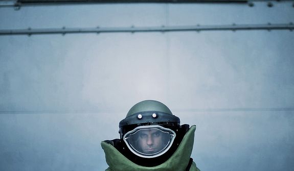 U.S. Air Force Explosive Ordnance Disposal (EOD) technician Staff Sgt. Salvatore DiGiacomo from the 514th Civil Engineer Squadron, Joint Base McGuire-Dix-Lakehurst, NJ., Demonstrates the EOD 9 bomb suit and helmet ensemble operational equipment on August 21, 2012 during Air Force Week in New York City, New York. (U.S. Air Force photo by Tech. Sgt. Jeremy T. Lock)