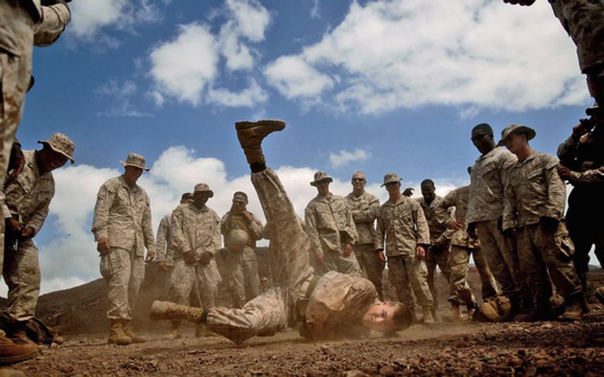 TIME FOR BREAK: Lance Cpl. Brett Herman from the 3rd Low Altitude Air Defense Battalion, Camp Pendleton, Calif., break dances during some down time in Djibouti in 2008. (Sgt. Jeremy T. Lock)
