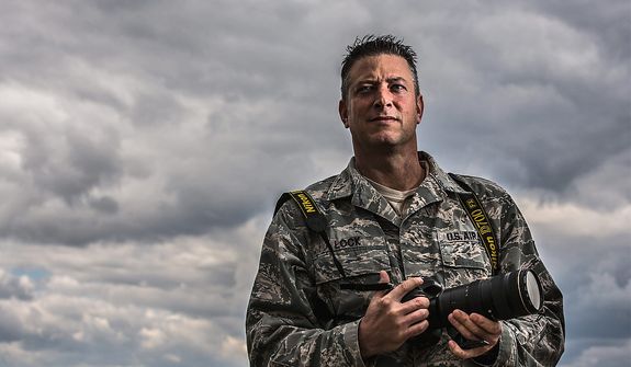 Master Sgt. Jeremy Lock, 42, stationed at the Defense Media Activity, in Ft. Meade, Md., poses for a photo after being named Military Photographer of the Year for the seventh time,Tuesday, March 26, 2013. (Andrew S Geraci/The Washington Times)
