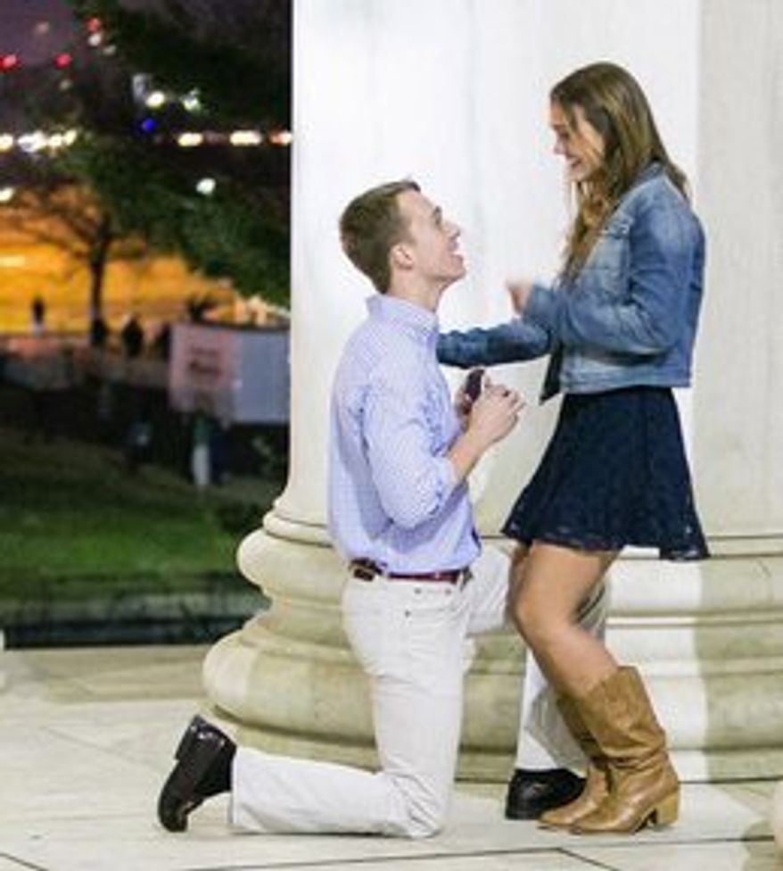 Kristin Hagelin smiles as her boyfriend Randy Carey proposes over Easter weekend at the Jefferson Memorial. The moment was a throwback to the chivalry often missing from modern relationships. (Alfredo Flores)