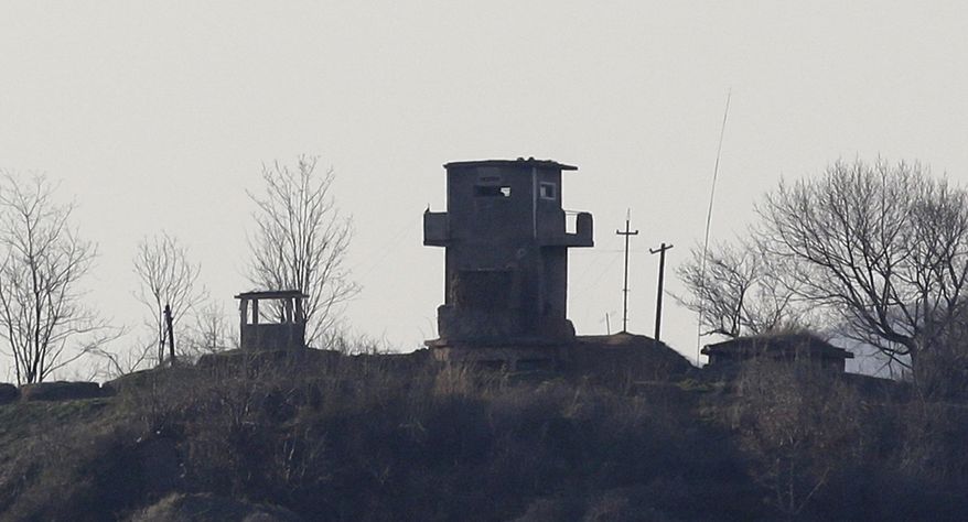 A North Korean military guard post is seen near the border village of Panmunjom, which has separated the two Koreas since the Korean War, in Paju, north of Seoul, on Sunday, April 7, 2013. (AP Photo/Lee Jin-man)