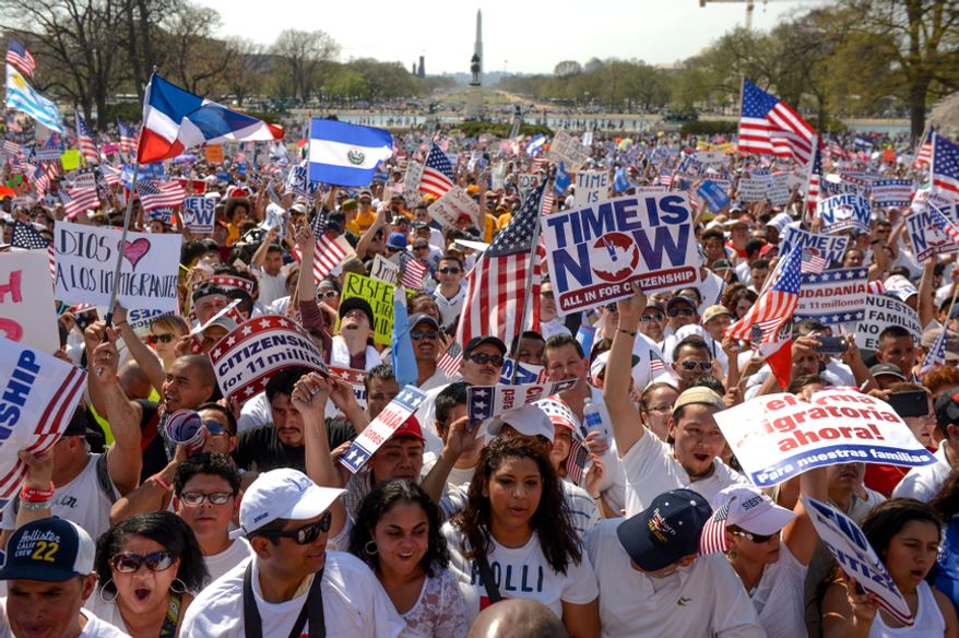 **FILE** Hundreds of people attend the National Rally for Citizenship on the west lawn of the U.S. Capitol in Washington on April 10, 2013, to call for immigration reform. (Andrew Harnik/The Washington Times)