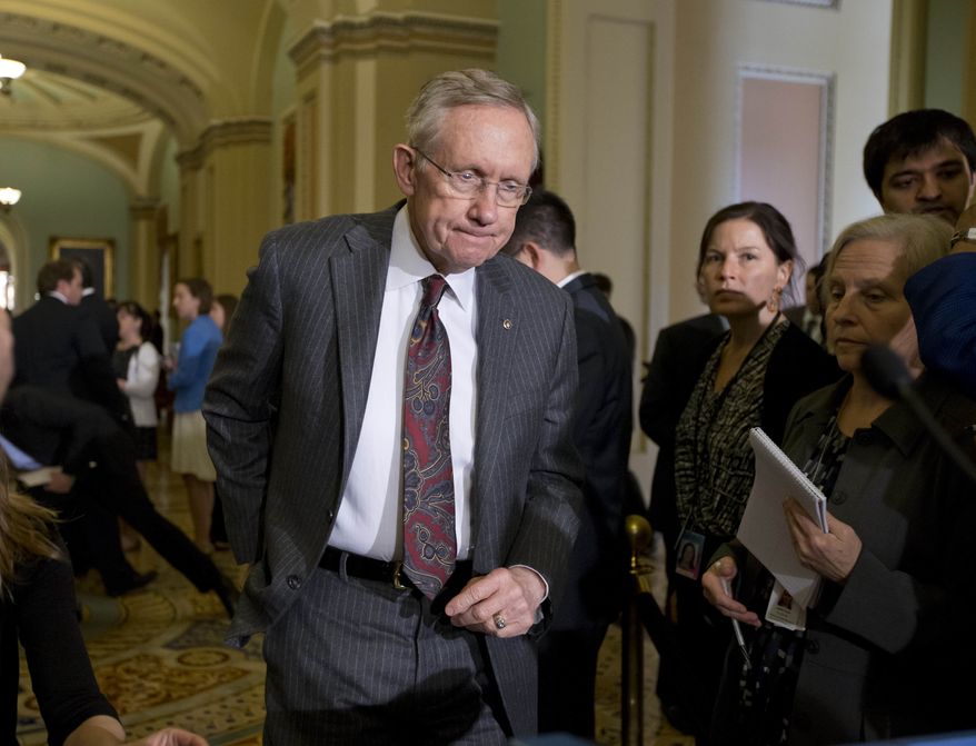 ** FILE ** Senate Majority Leader Harry Reid, Nevada Democrat, arrives to speak with reporters following a Democratic strategy session at the Capitol in Washington on Tuesday, April 9, 2013. (AP Photo/J. Scott Applewhite)