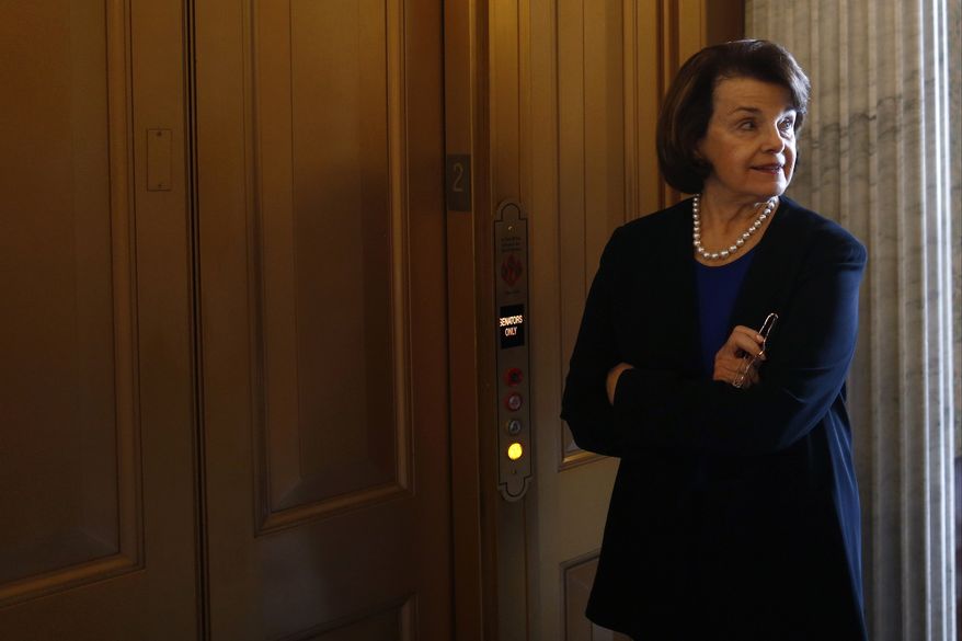 ** FILE ** Sen. Dianne Feinstein, D-Calif., waits for an elevator on Capitol Hill in Washington, Wednesday, April 17, 2013, after speaking about gun legislation on the Senate floor. (AP Photo/Charles Dharapak)