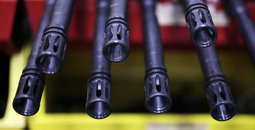 ** FILE ** The barrels of AR-15 rifles are pictured at Stag Arms in New Britain, Conn., on Wednesday, April 10, 2013. (AP Photo/Charles Krupa)