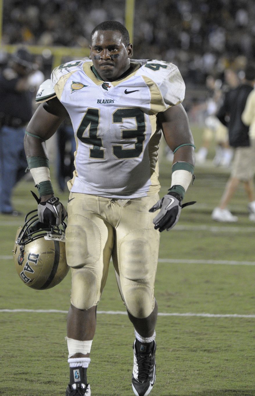 **FILE** UAB's Marvin Burdette walks off the field after an NCAA college football game against Central Florida in Orlando, Fla., Wednesday, Oct. 6, 2010. UCF won 42-7. (AP Photo/Phelan M. Ebenhack)