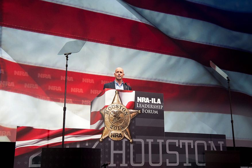 Retired U.S. Air Force Maj. Dan Rooney speaks during the leadership forum at the National Rifle Association's annual meeting Friday, May 3, 2013 in Houston. (AP Photo/Steve Ueckert)