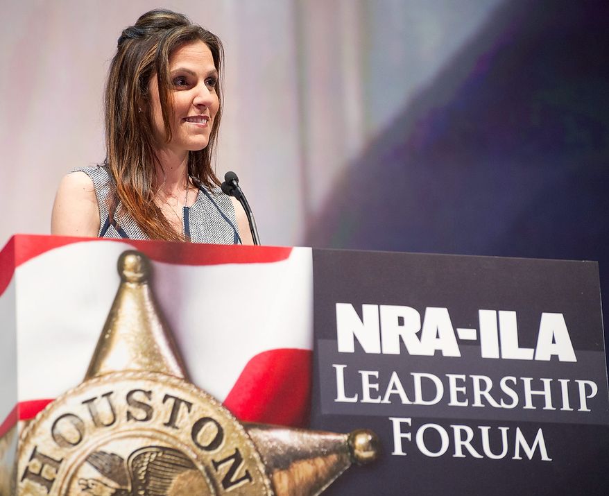 Taya Kyle, widow of author and former Navy SEAL sniper Chris Kyle, speaks during the leadership forum at the National Rifle Association's annual convention in Houston on May 3, 2013. (Associated Press) **FILE**
