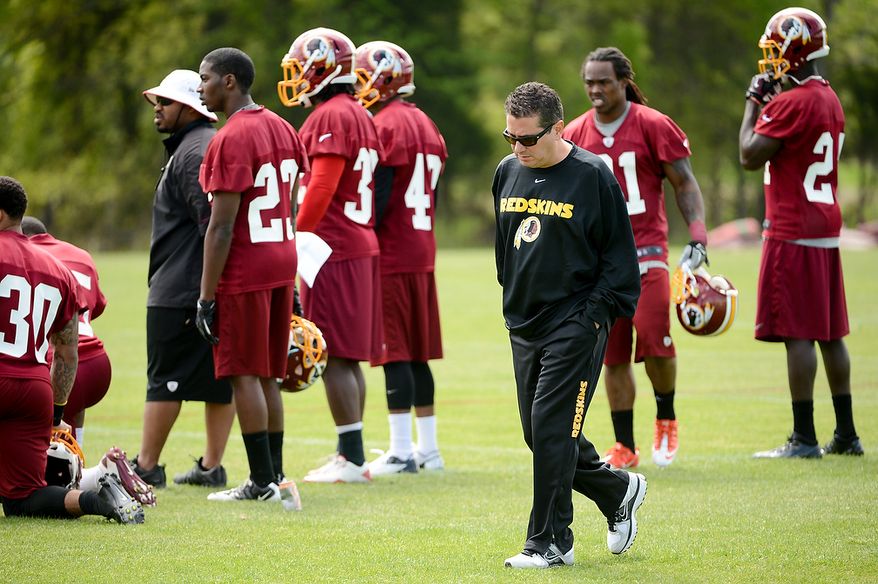 Washington Redskins owner Dan Snyder walks the sidelines during the team's rookie minicamp at Redskins Park in Ashburn, Va., on Sunday, May 5, 2013. (Andrew Harnik/The Washington Times)