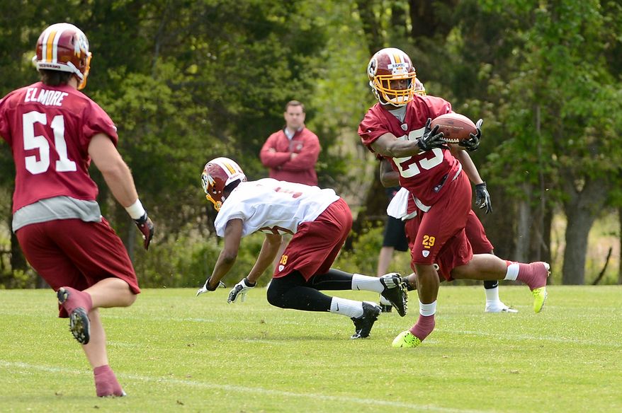 Washington Redskins safety Bacarri Rambo (29) makes an interception during a scrimmage at the team's rookie minicamp at Redskins Park in Ashburn, Va., on Sunday, May 5, 2013. (Andrew Harnik/The Washington Times)