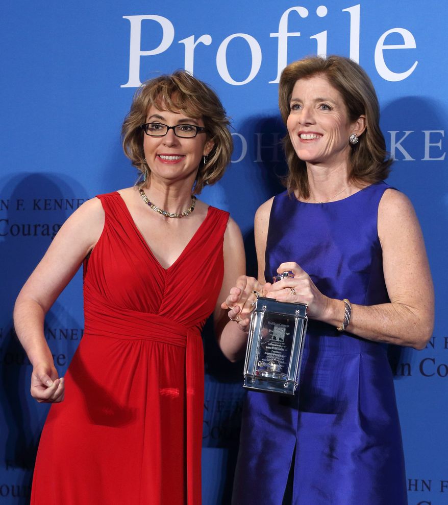Caroline Kennedy (right) poses with former Arizona congresswoman Gabrielle Giffords after presenting her with the John F. Kennedy Profile in Courage Award at the JFK Library in Boston on May 5, 2013. (Associated Press)