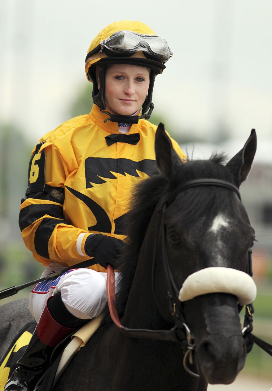 FILE - In this May 4, 2013, file photo, Mylute, with jockey Rosie Napravnik aboard, is led out during the post parade for the 139th running of the Kentucky Derby horse race at Churchill Downs Saturday in Louisville, Ky. Napravnik won her first race at Pimlico Race Course as a 17-year-old, and now, eight years later, she has a chance to become the first female jockey to win the Preakness. Napravnik will be aboard Mylute in Saturday's big race. (AP Photo/Gregory Payan, File)