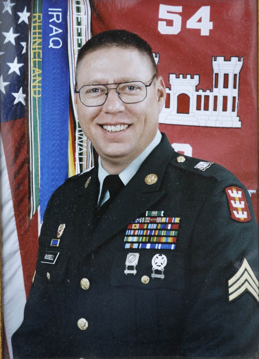 ** FILE ** This U.S. Army photo made available by the Russell family on Tuesday, May 12, 2009, shows U.S. Army Sgt. John M. Russell. Russell pleaded guilty Monday to killing four other soldiers and a Navy officer in 2009 at mental health clinic in Baghdad during the Iraq War. The plea agreement in a military court at Joint Base Lewis-McChord means Russell will avoid the death sentence. (AP Photo/Family photo)