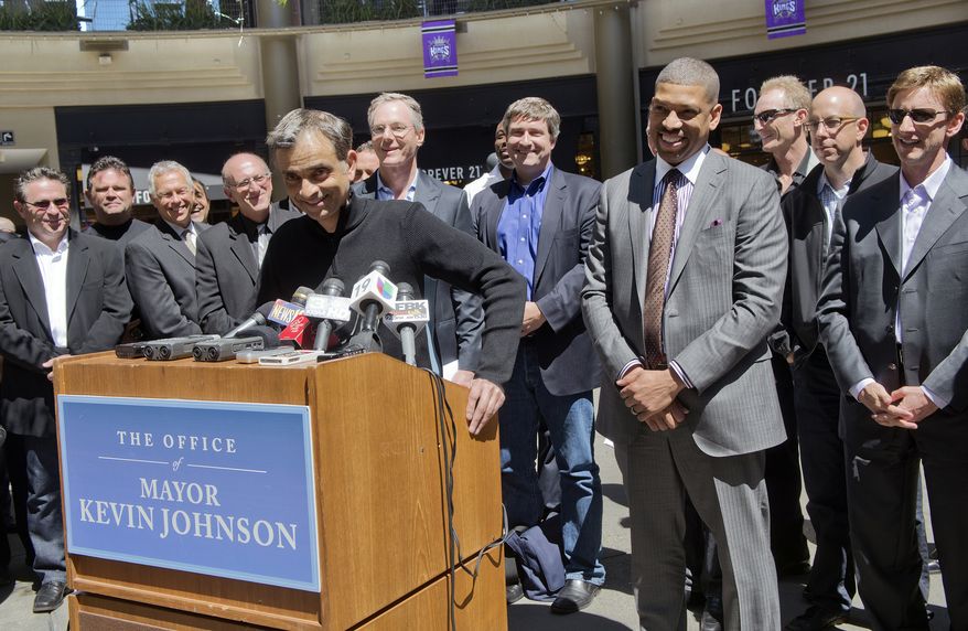 **FILE** TIBCO software chairman Vivek Ranadive, also a minority owner of the Golden State Warriors, speaks at a news conference with Sacramento Mayor Kevin Johnson, right, in Sacramento, Calif., on April 16, 2013. The potential Sacramento ownership group is headlined by Ranadive and 24 Hour Fitness founder Mark Mastrov. The Maloof family reached an agreement in January to sell a 65 percent controlling interest of the Kings to a Seattle group led by hedge-fund manager Chris Hansen at a total franchise valuation of $525 million, an NBA record, that would move the team to Seattle. (Associated Press/The Sacramento Bee)