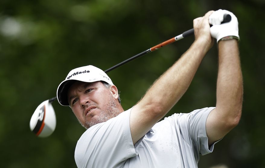 Boo Weekley watches his tee shot on the sixth hole during the final round of the Colonial golf tournament, Sunday, May 25, 2013, in Fort Worth, Texas. (AP Photo/LM Otero)