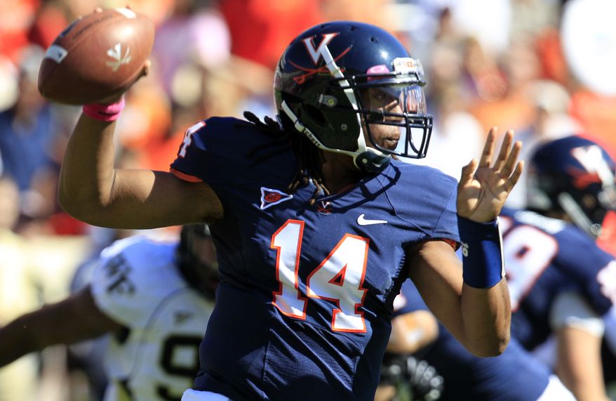 FILE - In this Oct. 20, 2012 file photo, Virginia quarterback Phillip Sims (14) prepares to pass during the first half of an NCAA college football game against Wake Forest at Scott Stadium in Charlottesville, Va. Sims' time at Virginia is finished. The heralded transfer from Alabama is ineligible to play and will leave the university after completing his current summer school session, coach Mike London announced Friday, May 31, 2013. London said in a statement released by the school that "Phillip did not make the commitment he needed to succeed here."(AP Photo/Steve Helber, File)