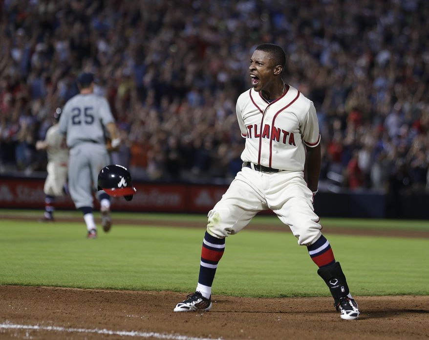 B.J. Upton celebrates his game-winning hit as the Nationals walk off the field following a 2-1 loss. (Associated Press photo)