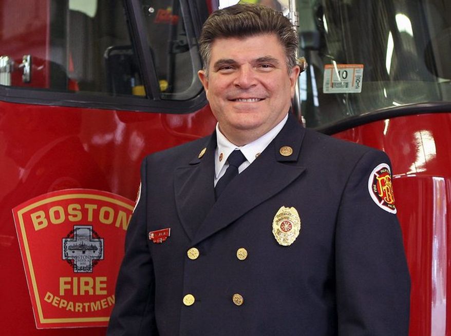In this Nov. 16, 2011, photo, Boston Fire Chief Steve Abraira poses for a photo at a fire station in Boston. In a letter dated Monday, June 3, 2013, Abraira said he is resigning effecting on Friday, saying public criticism from his deputies for the way he responded to the marathon bombings has made it impossible for him to do his job. (AP Photo/Boston Herald, Mark Garfinkel)