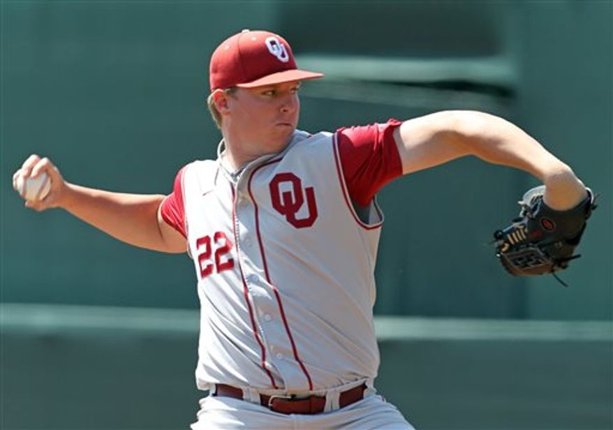 FILE - In this June 3, 2012 file photo, Oklahoma pitcher Jonathan Gray (22) throws a pitch during an NCAA college baseball regional game against Army in Charlottesville, Va. (AP Photo/Andrew Shurtleff, File)