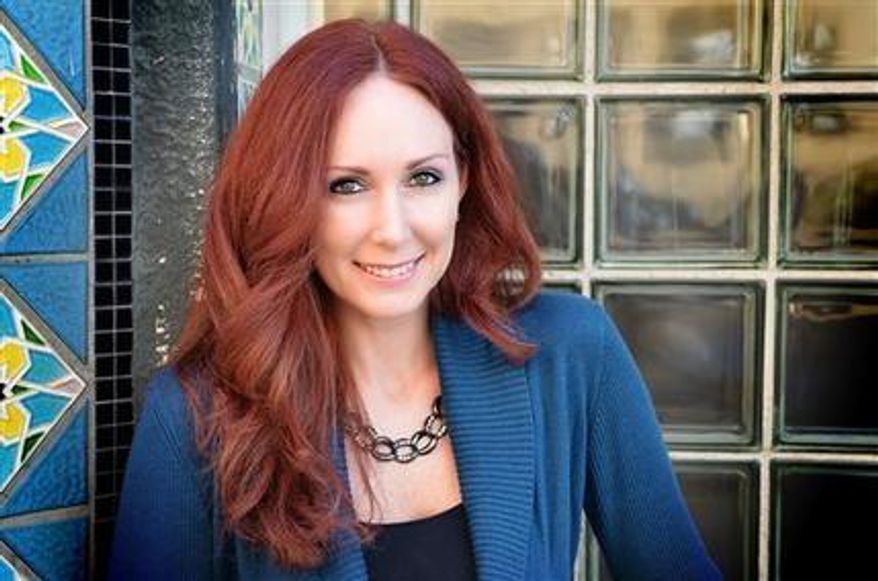 Shannon Richardson poses for a photo, in Texarkana, Texas in this undated photo. Richardson made an initial appearance in a Texarkana, Texas, courtroom Friday, June 7, 2013, after being charged with mailing a threatening communication to the president. She could face up to 10 years in prison if convicted, U.S. attorney's office spokeswoman Davilyn Walston said. (Associated Press)