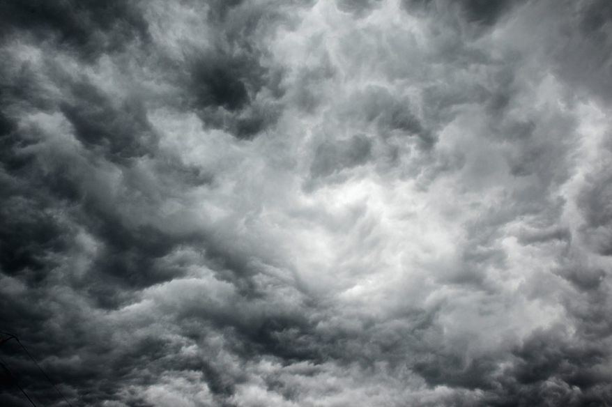 Swirling morning storm clouds can be seen on Interstate 66, Arlington, Va., Thursday, June 13, 2013. (Andrew Harnik/The Washington Times)