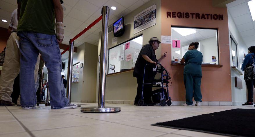 **FILE** Patients wait in line at Nuestra Clinica Del Valle in San Juan, Texas, on Sept. 6, 2012. (Associated Press)