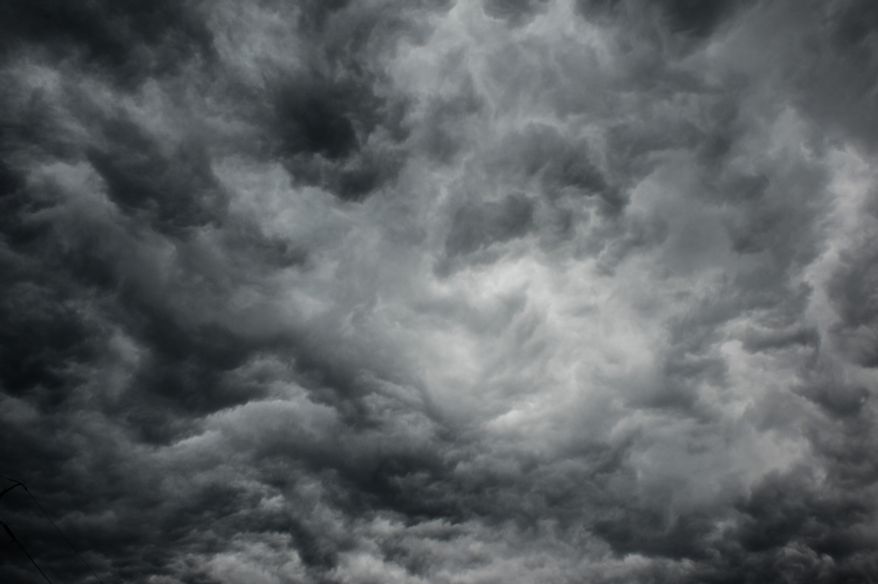 Swirling morning storm clouds can be seen on Interstate 66, Arlington, Va., Thursday, June 13, 2013. (Andrew Harnik/The Washington Times)