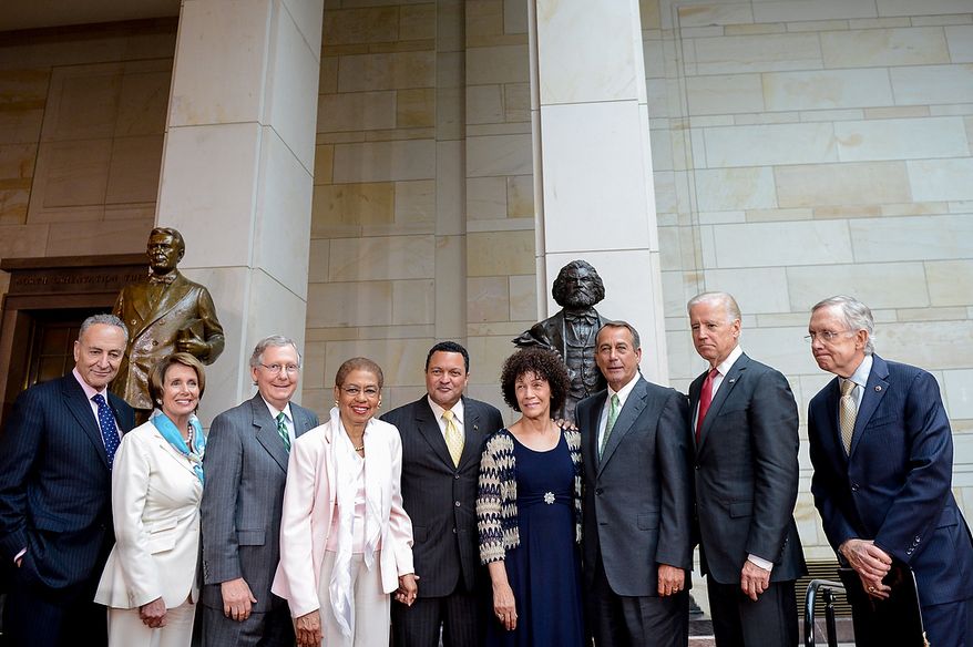 Left to right: Sen. Chuck Schumer (D-N.Y.), House Minority Leader Nancy Pelosi (D-Calif.), Senate Minority Leader Mitch McConnell (R-Ky.), Delegate Eleanor Holmes Norton (D-D.C.), the great great-great-great grandson of Frederick Douglass Kenneth B. Morris, Jr., the great great granddaughter of Frederick Douglass Nettie Washington Douglass, Speaker of the House John Boehner (R-Ohio), U.S. Vice President Joe Biden and Senate Majority Leader Harry Reid (D-Nev.) pose together at a congressional ceremony to commemorate the dedication and unveiling of a statue of Frederick Douglass in Emancipation Hall of the the United States Visitors Center, Washington, D.C., Wednesday, June 19, 2013. (Andrew Harnik/The Washington Times)