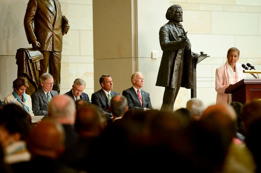 Rep. Eleanor Holmes Norton (D-D.C.), right, speaks at a congressional ceremony to commemorate the dedication and unveiling of a statue of Frederick Douglass in Emancipation Hall of the the United States Visitors Center, Washington, D.C., Wednesday, June 19, 2013. Also pictured left to right is House Democratic Leader Nancy Pelosi, Senate Republican Leader Mitch McConnell, Senate Majority Leader Harry Reid, House Speaker John Boehner and Vice President Joe Biden. (Andrew Harnik/The Washington Times)