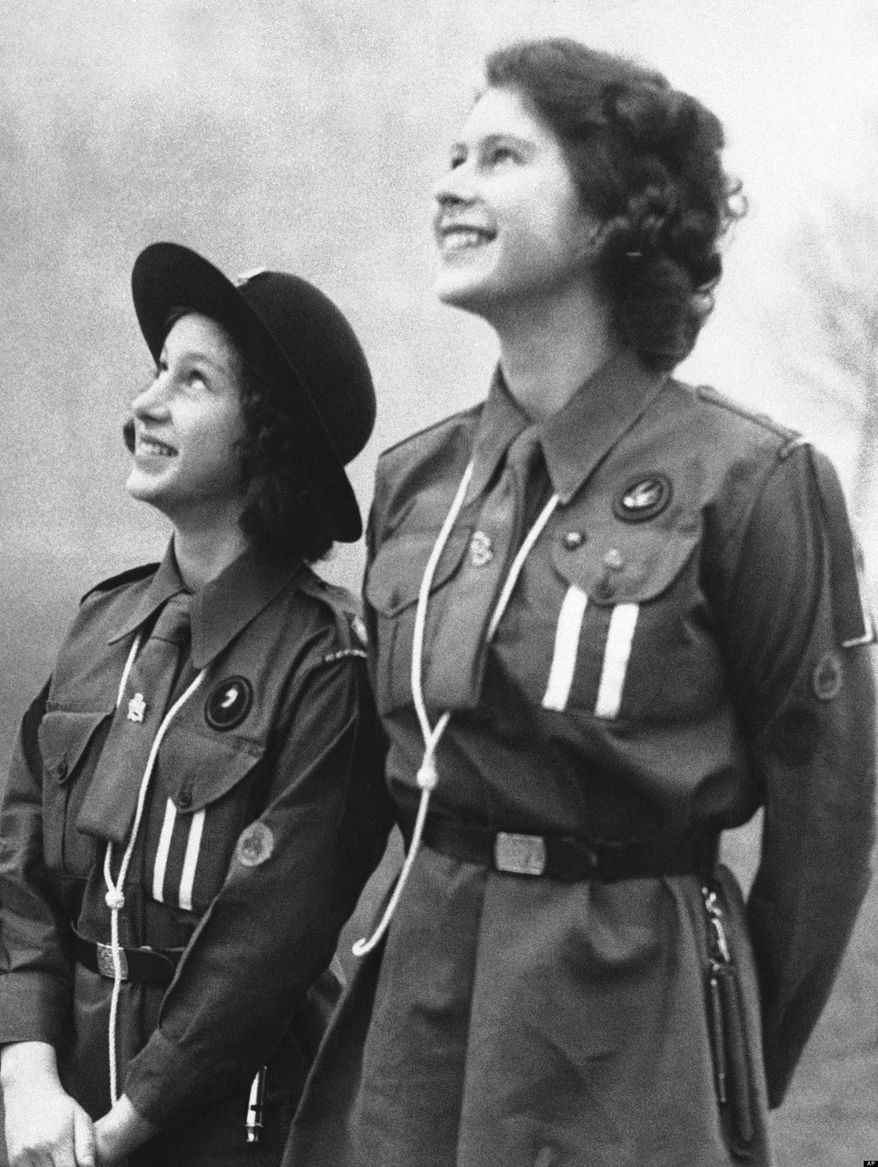 ** FILE ** Britain's Princess Elizabeth releasing a carrier pigeon in honor of the late Lord Baden-Powell, founder of Britain's Scout movement, Feb. 20, 1943. (Associated Press)