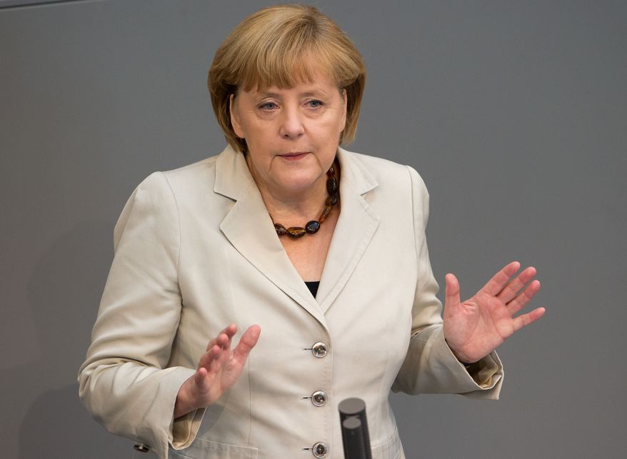 ** FILE ** German Chancellor Angela Merkel, June 27, 2013. (AP Photo/dpa, Tim Brakemeier)