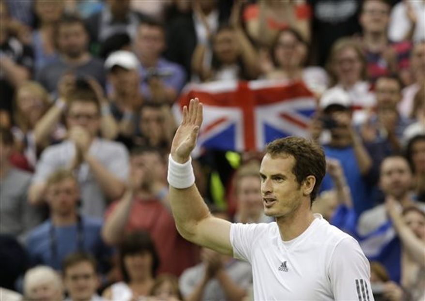 Andy Murray of Britain reacts after defeating Tommy Robredo of Spain during their Men's singles match at the All England Lawn Tennis Championships in Wimbledon, London, Friday, June 28, 2013. (AP Photo/Anja Niedringhaus)